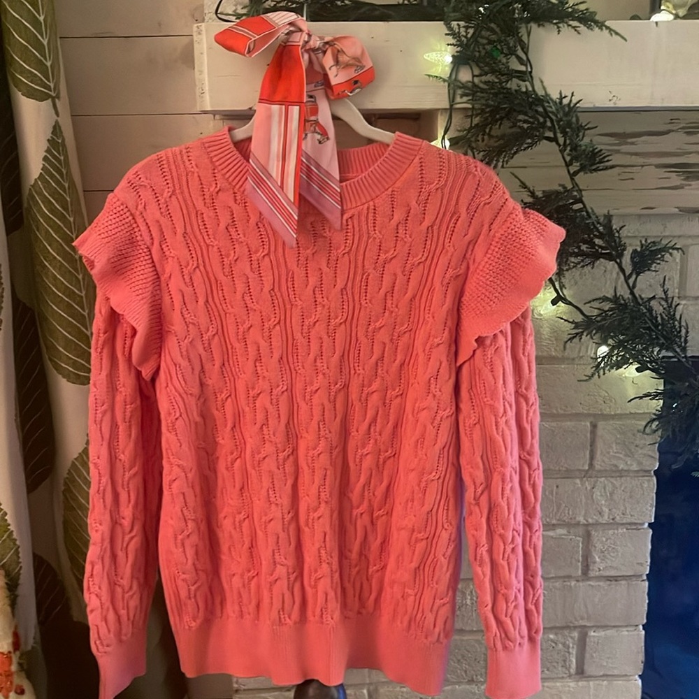 Bright pink cable knit sweater